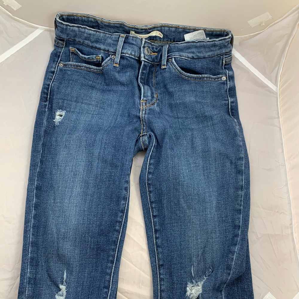 Levi’s 711Skinny blue jeans size 26 distressed like new